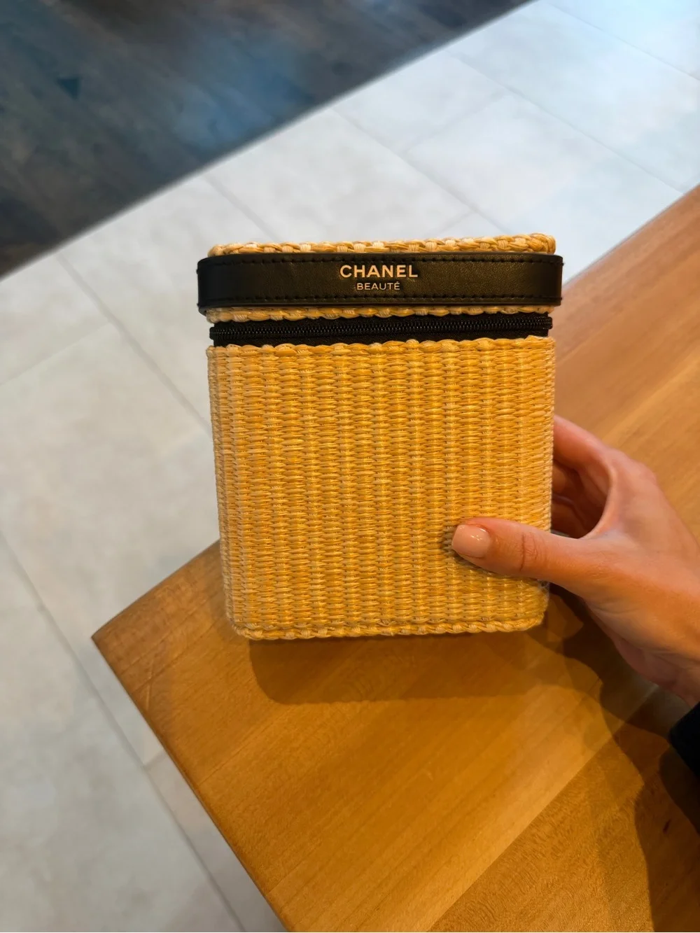 CHANEL Straw Cosmetic Case in Natural and Black with products